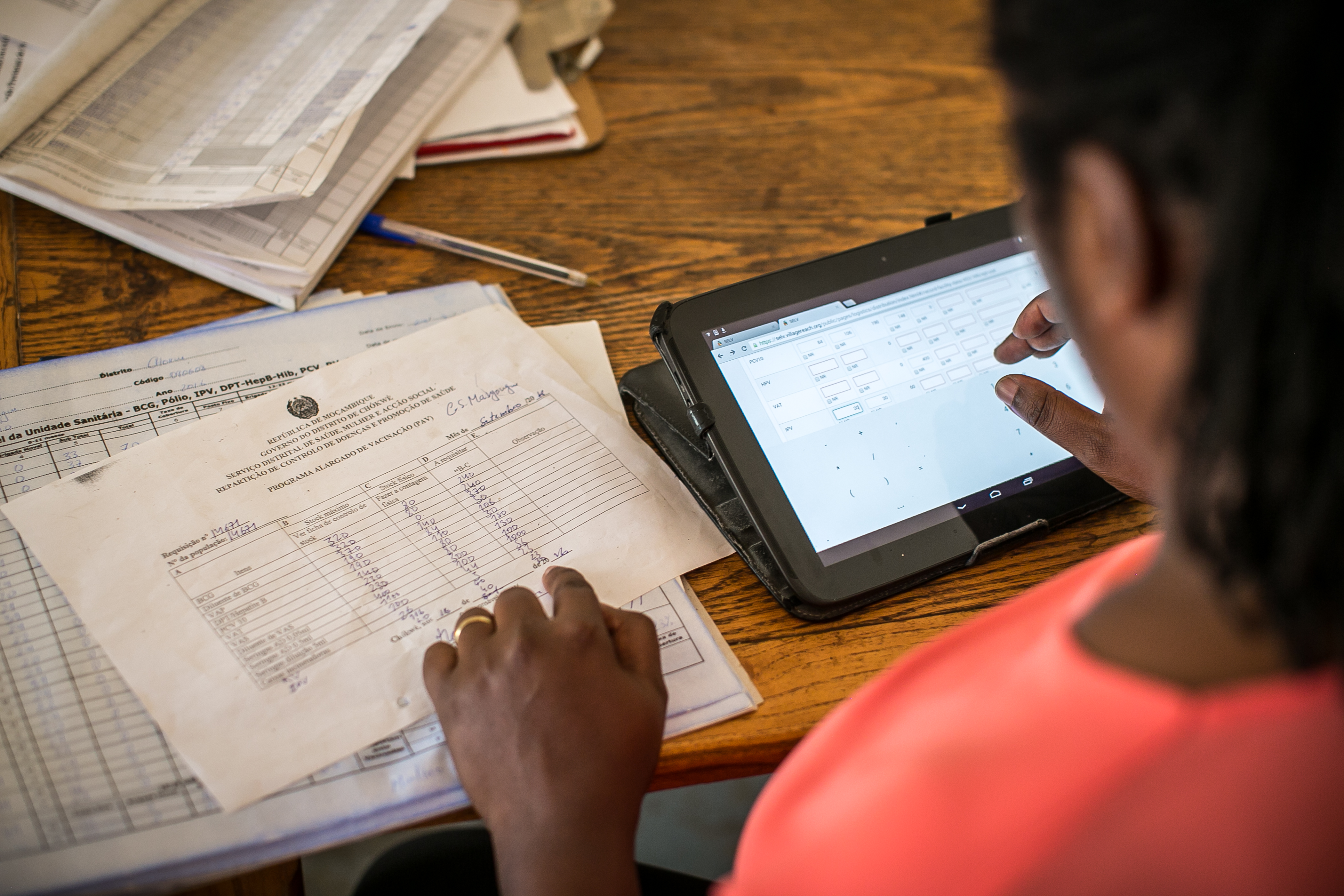 Woman using OpenLMIS, a public health open source software system