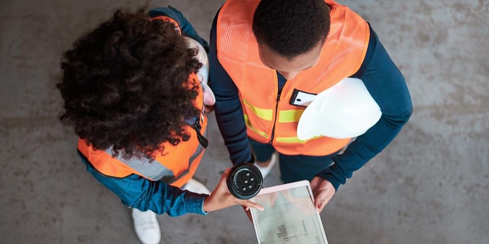 Two employees discussing a sustainable supply chain