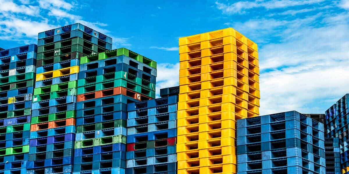 An effective sustainability team's strategy for organizing multicolored shipping crates.  