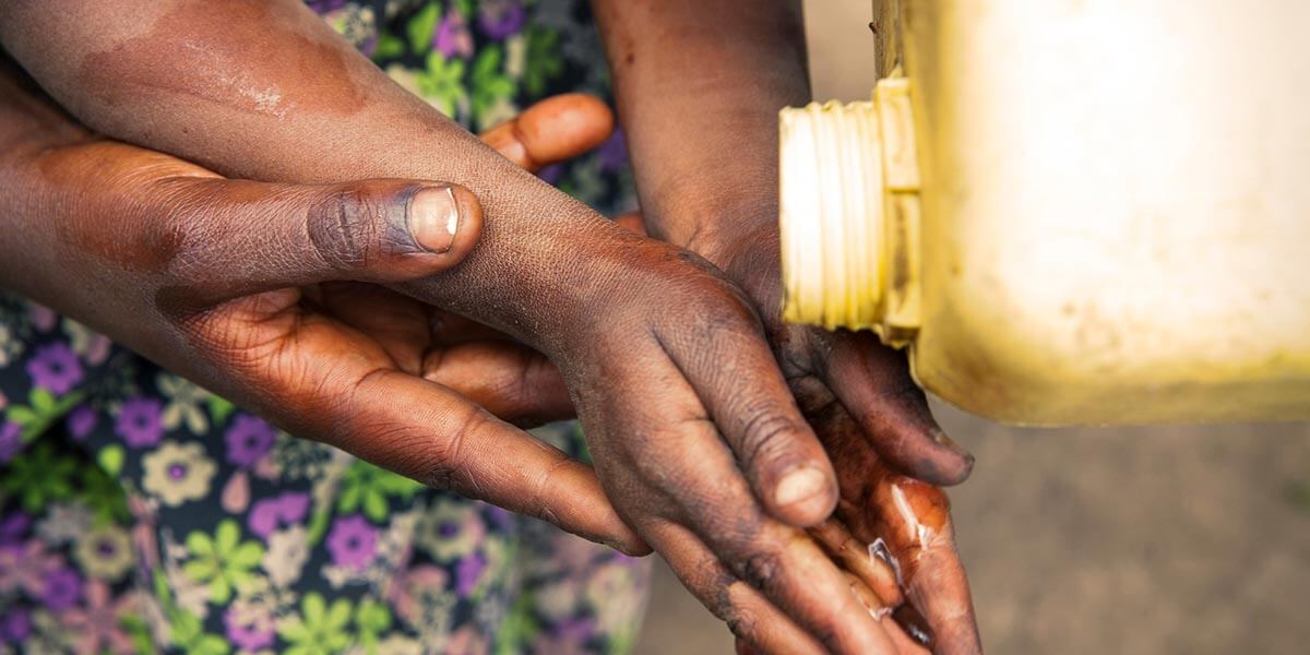 Young female with access to Water, Sanitation, and Hygiene (WASH). 